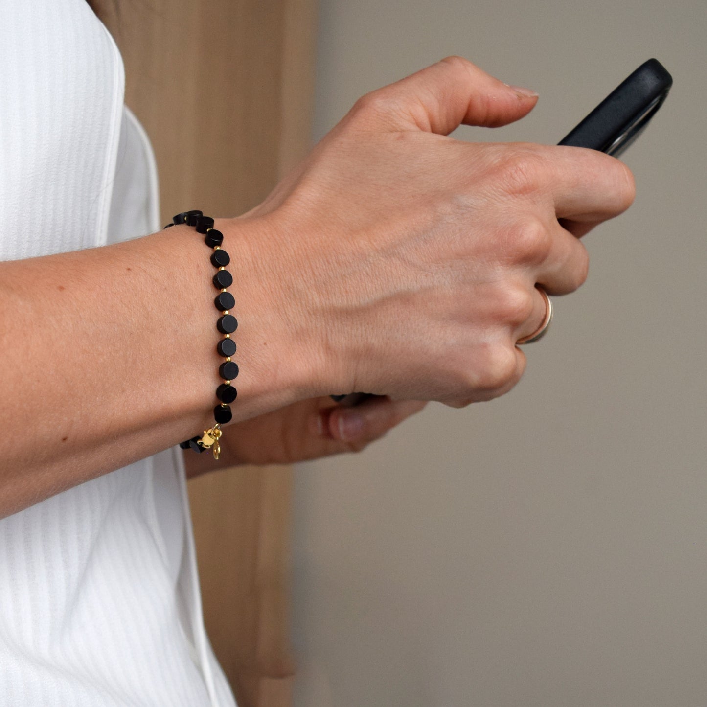 Minimalist amber bracelet worn on wrist, elegant everyday jewelry inspired by nature
