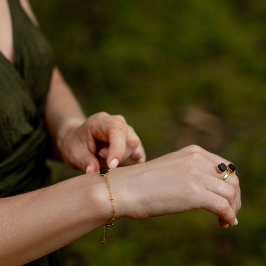 Cleaning Baltic amber jewelry with a soft cloth to preserve natural shine