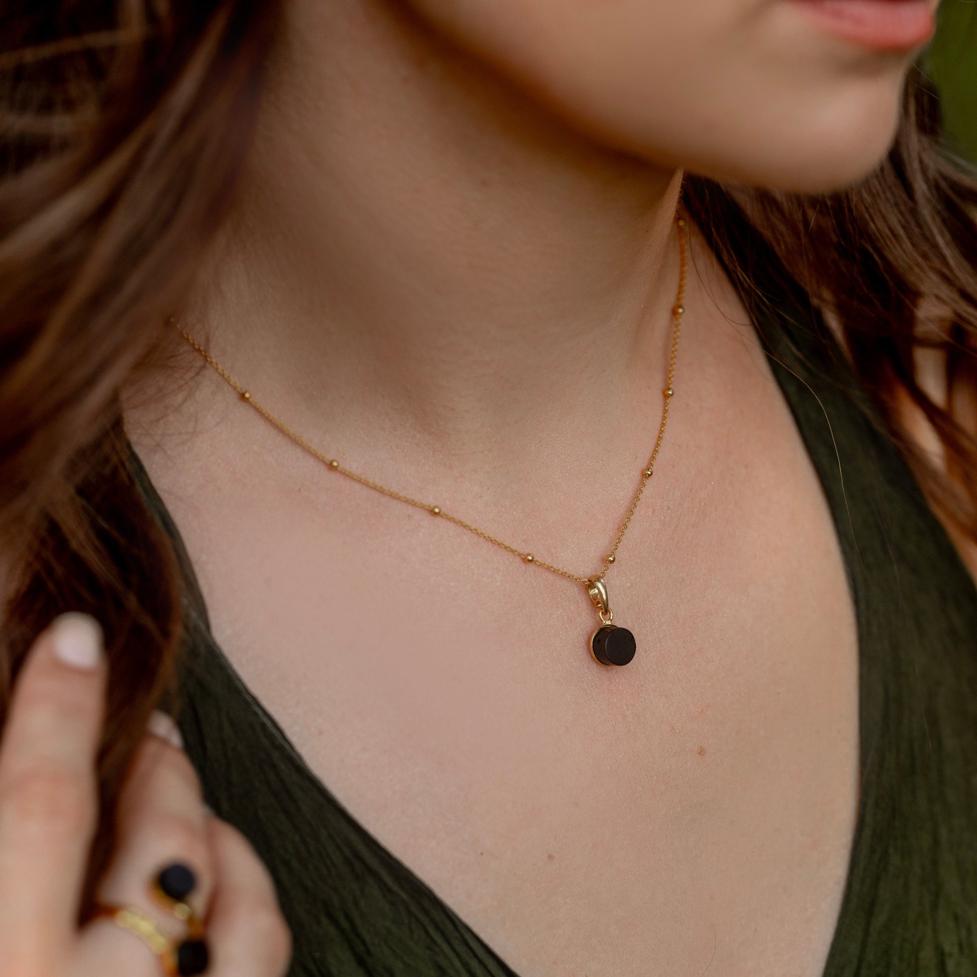 black baltic amber pendant close up amber detail